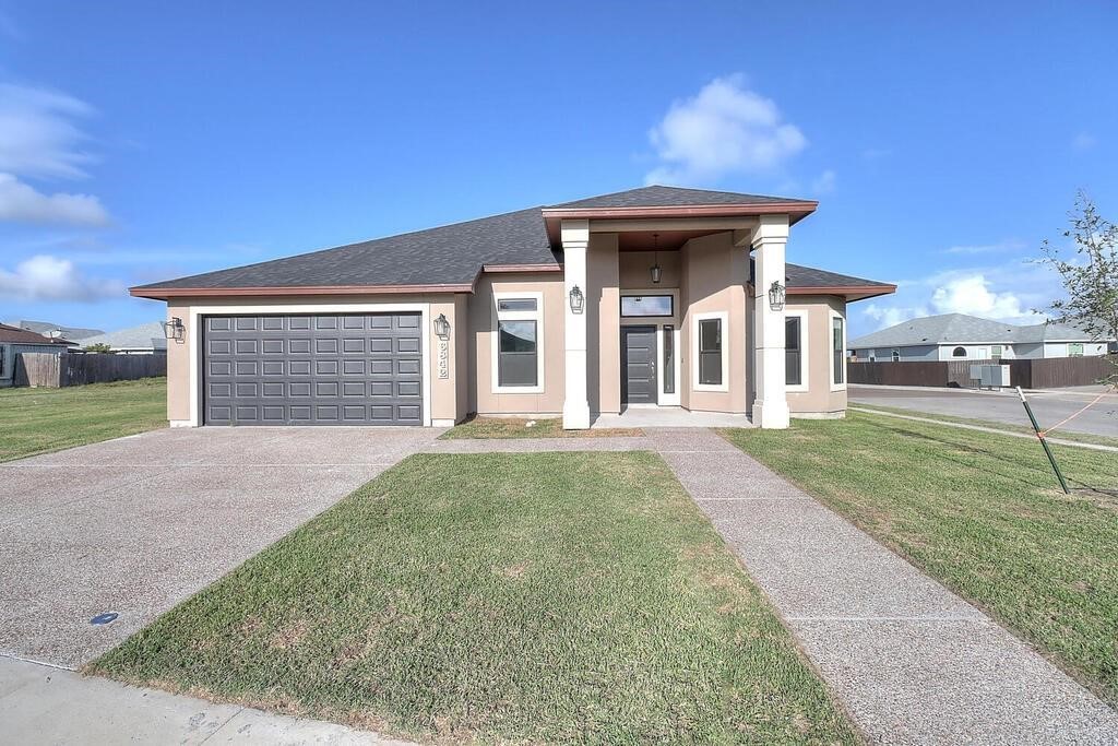 front view of a house with a yard