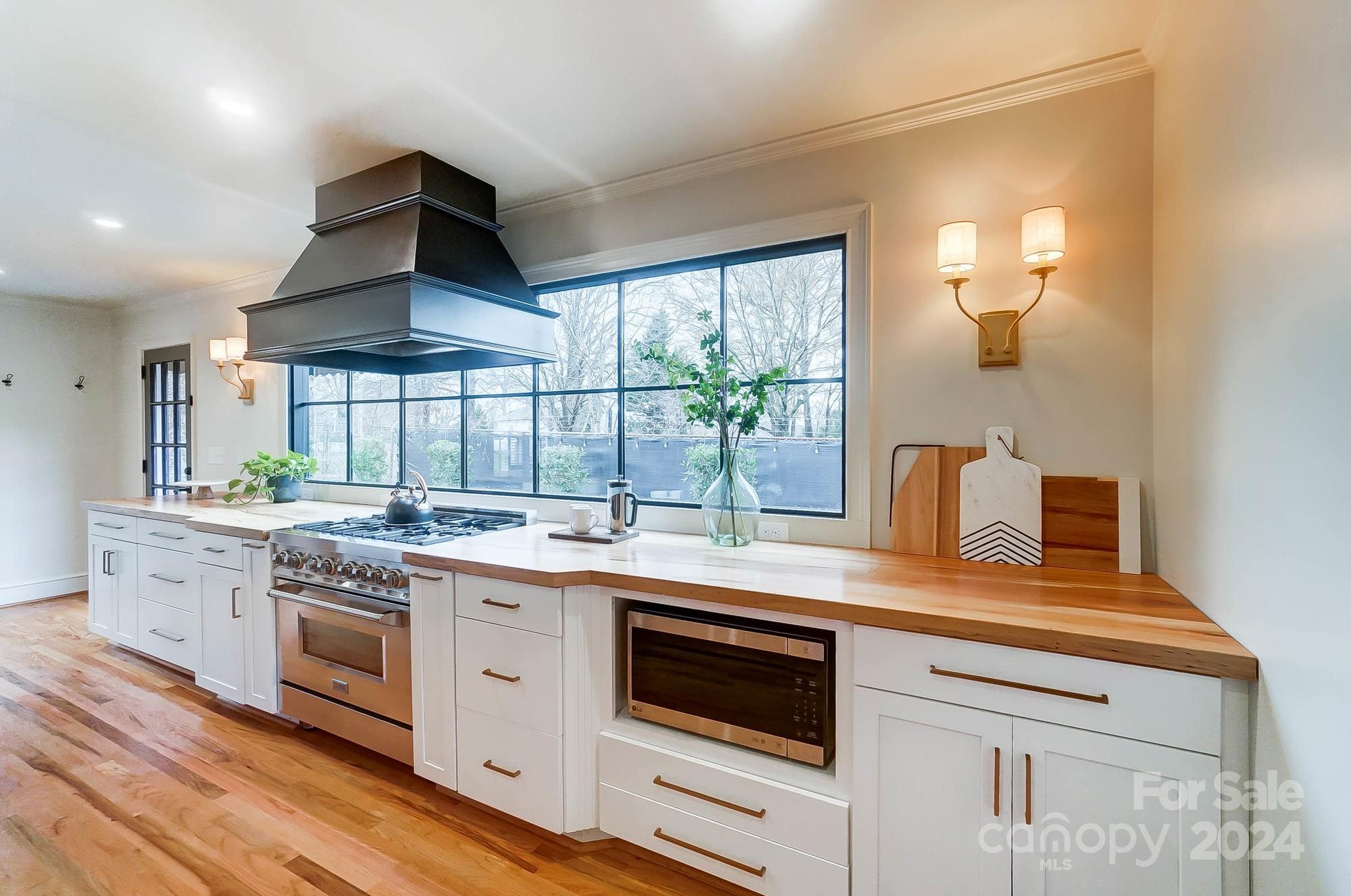 a kitchen with a stove and a sink