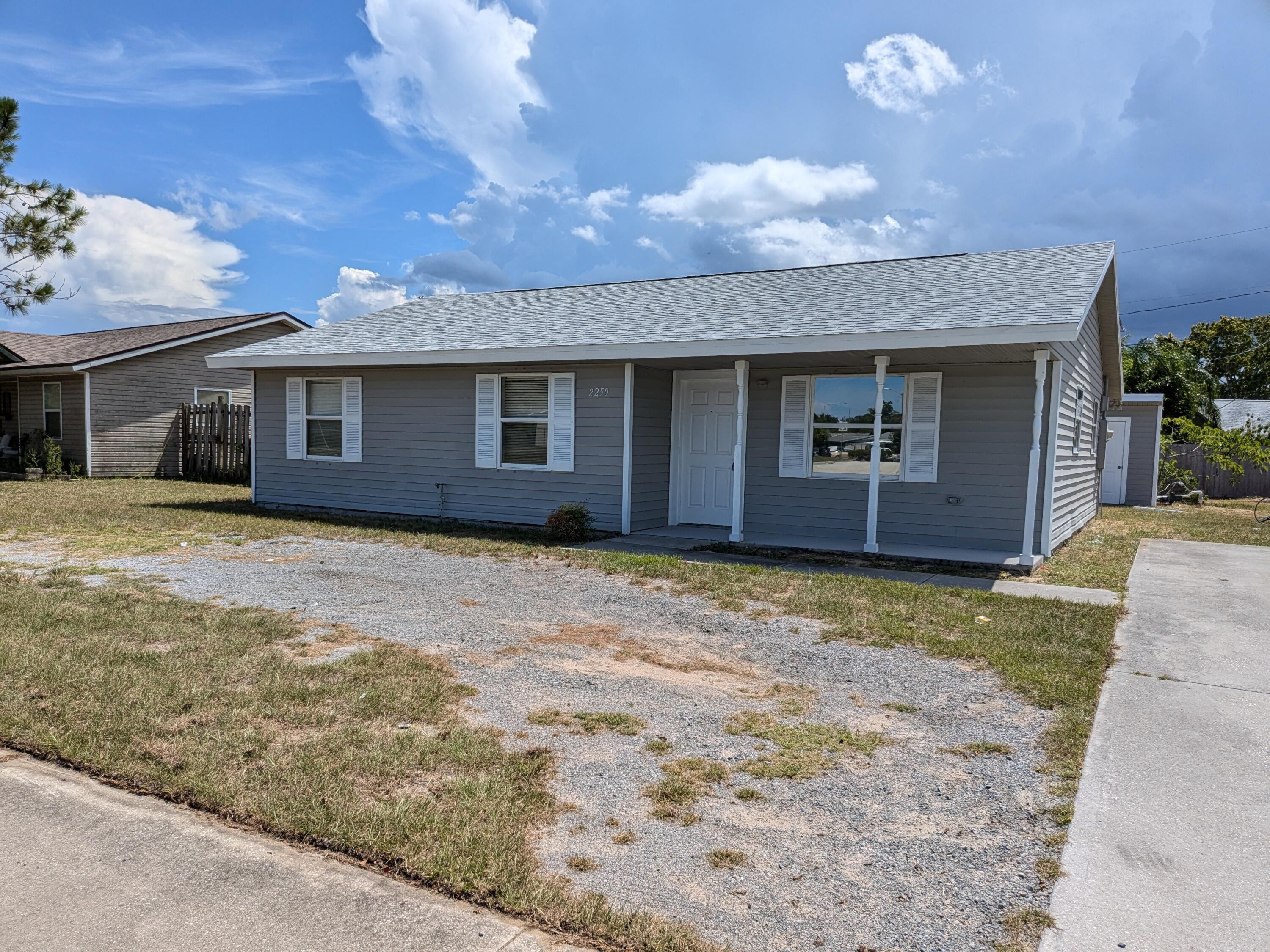 front view of a house with a yard