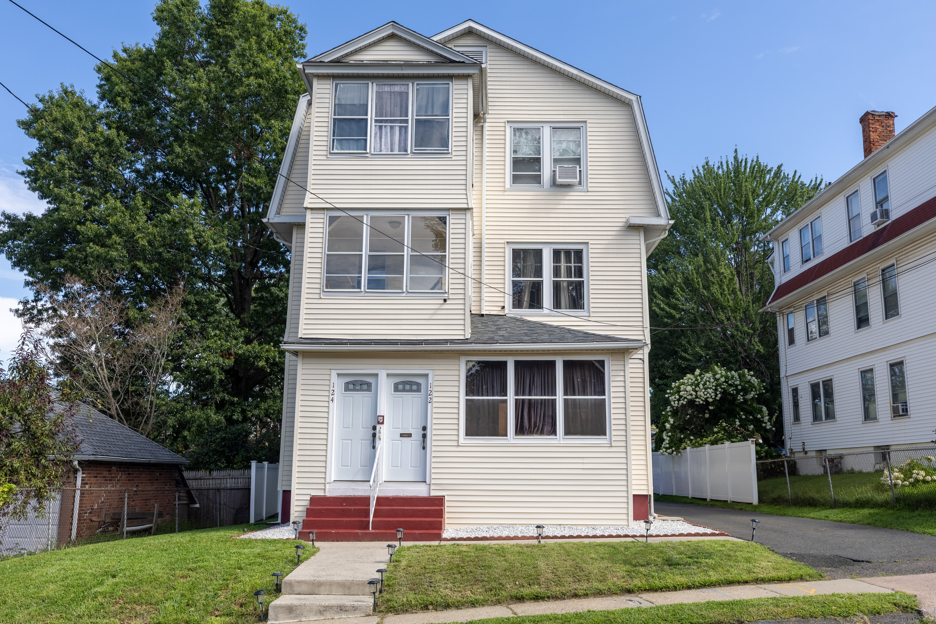 a front view of a house with a yard