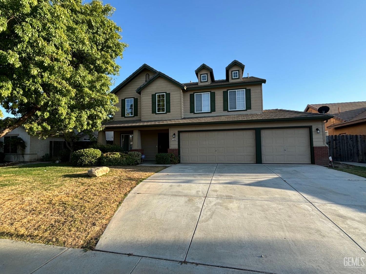 a front view of a house with yard