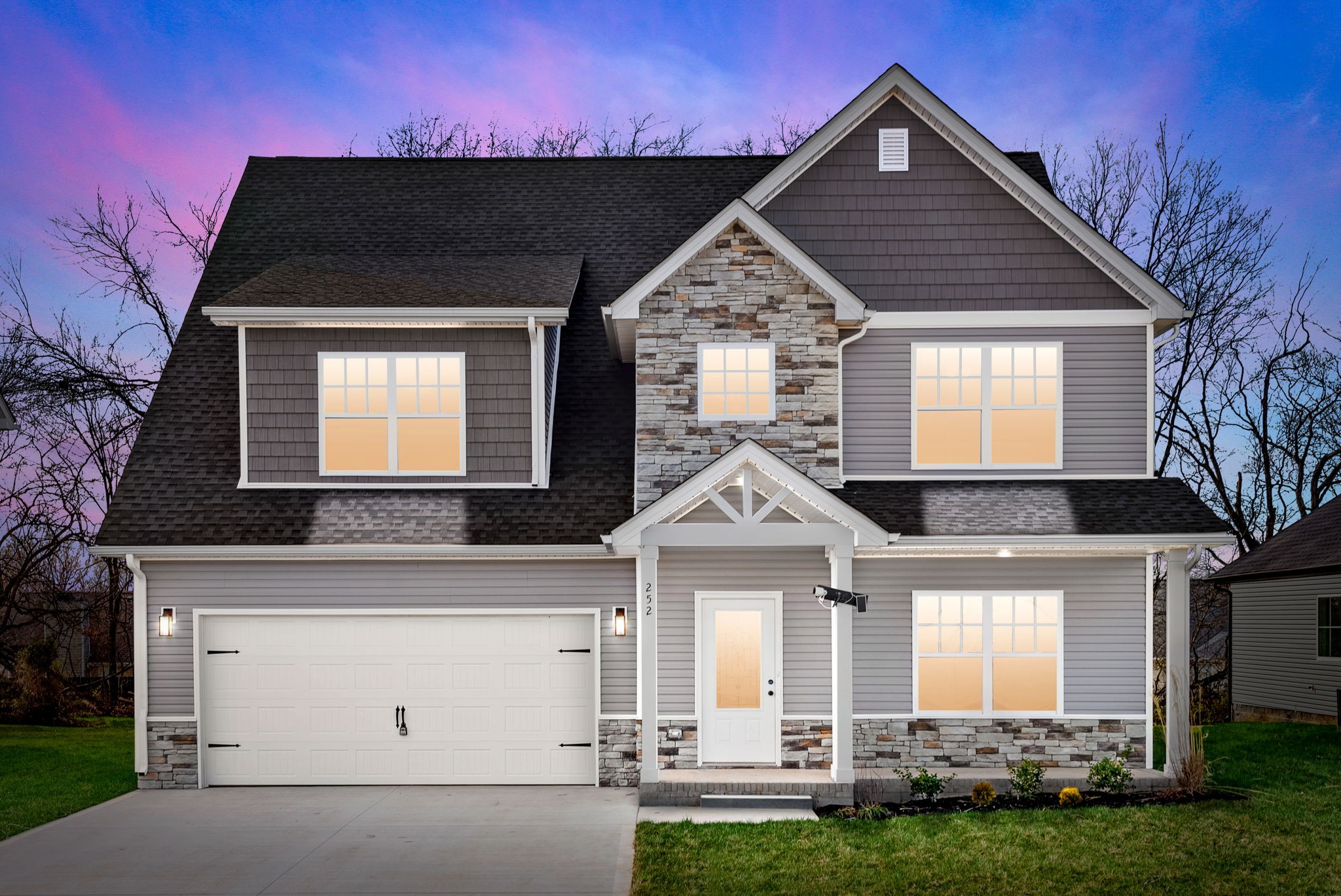 a front view of a house with a yard