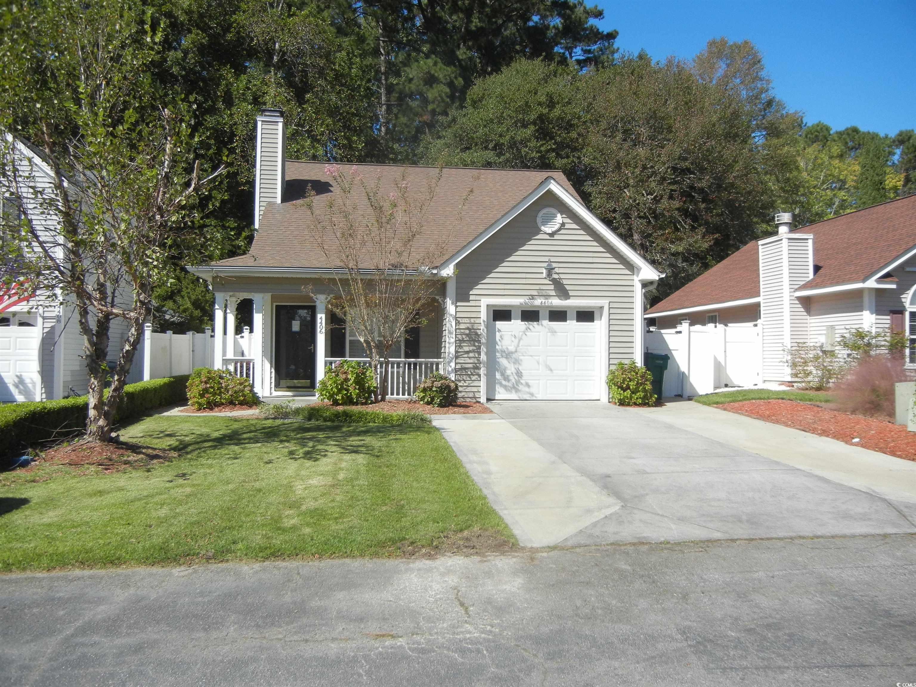 View of front of home featuring a front yard, a po