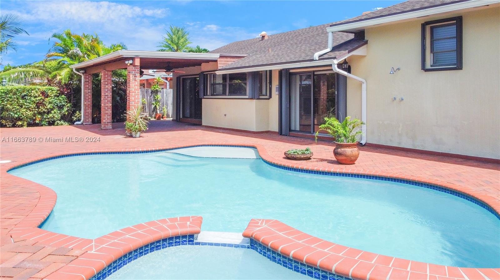 a front view of house with an outdoor space and seating