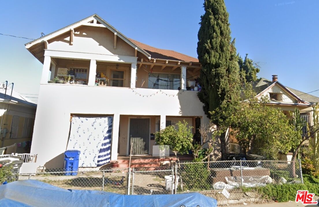 a front view of house with yard outdoor seating and green space