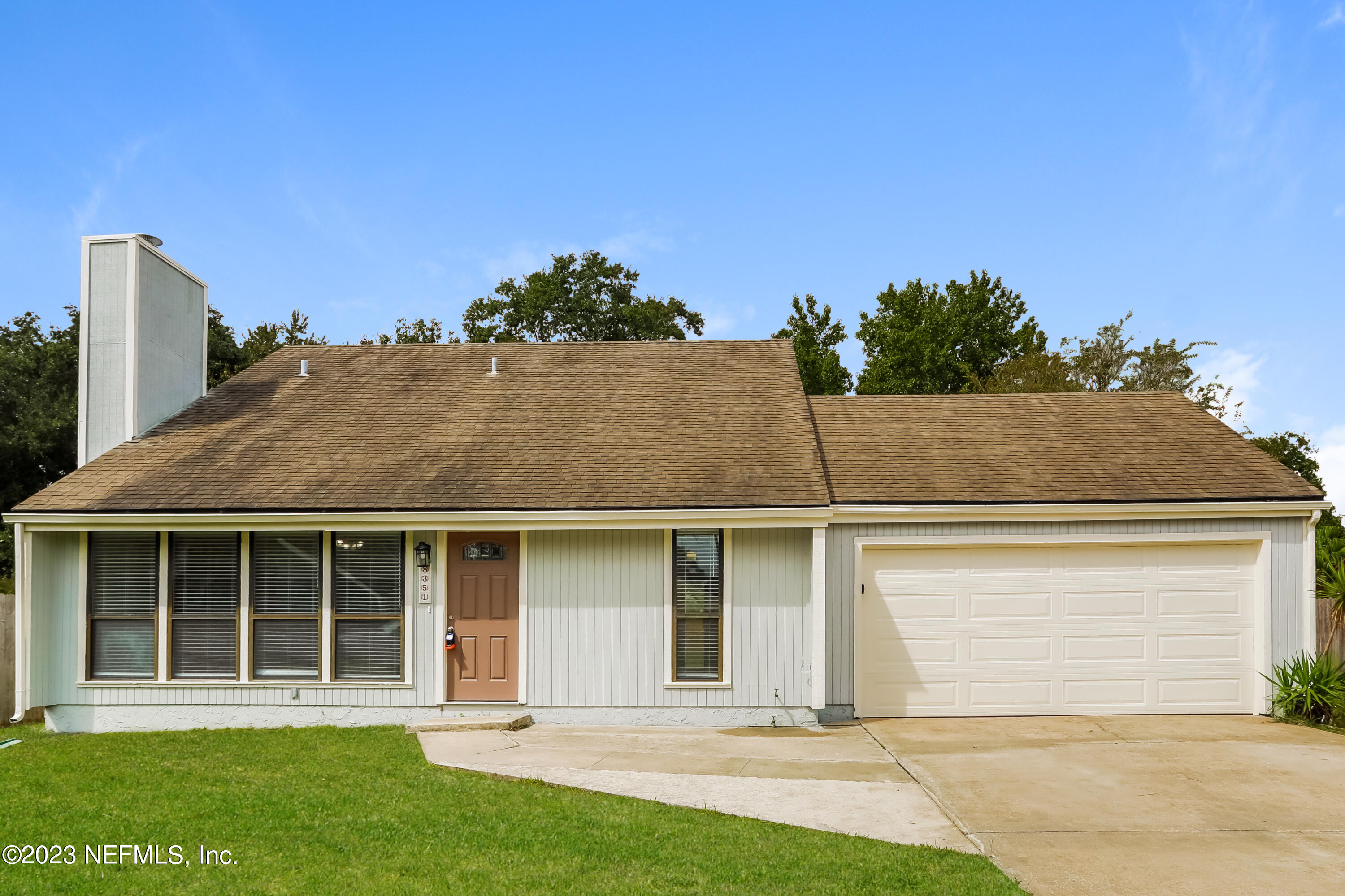 front view of a house with a yard