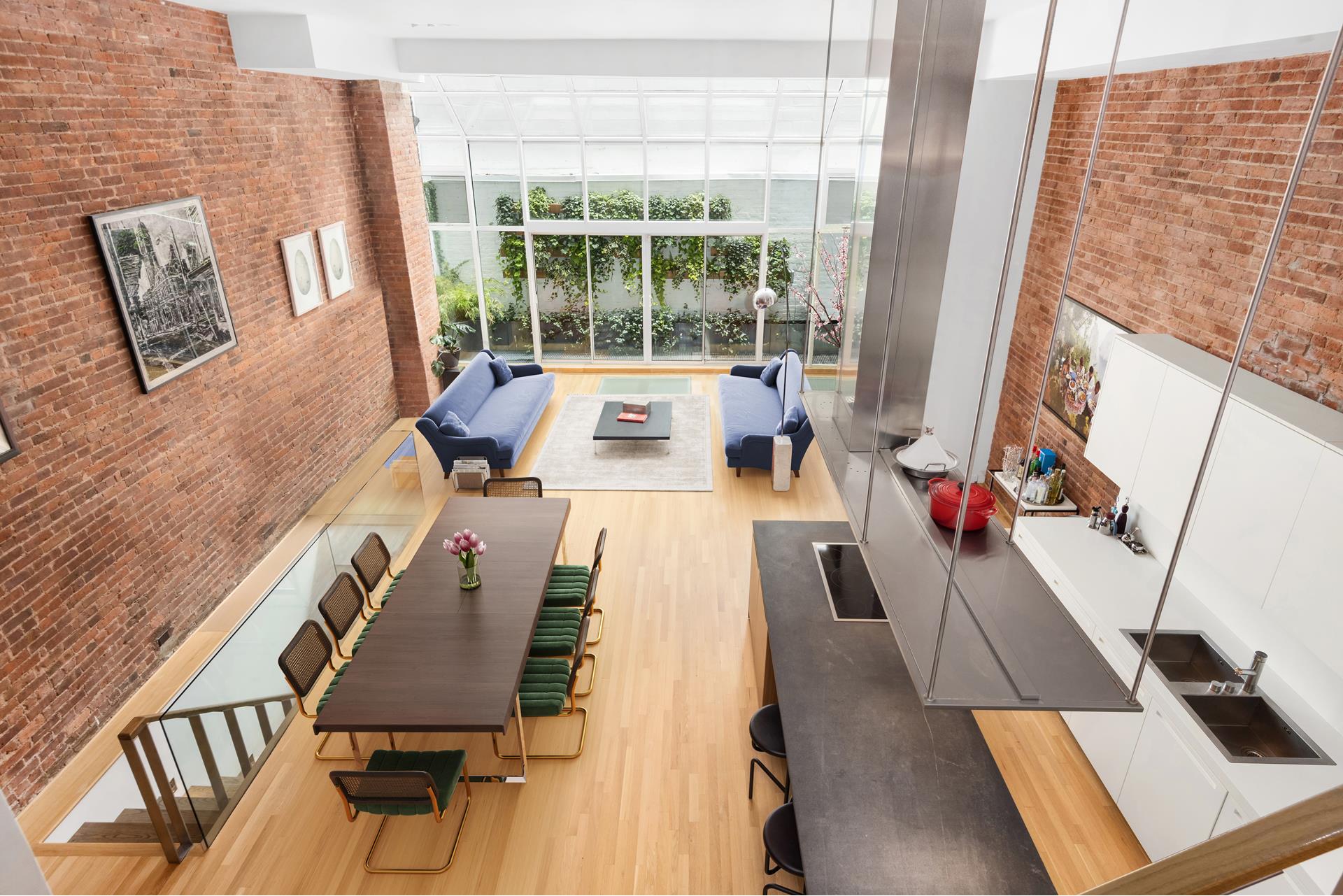 a view of living room with furniture and a flat screen tv