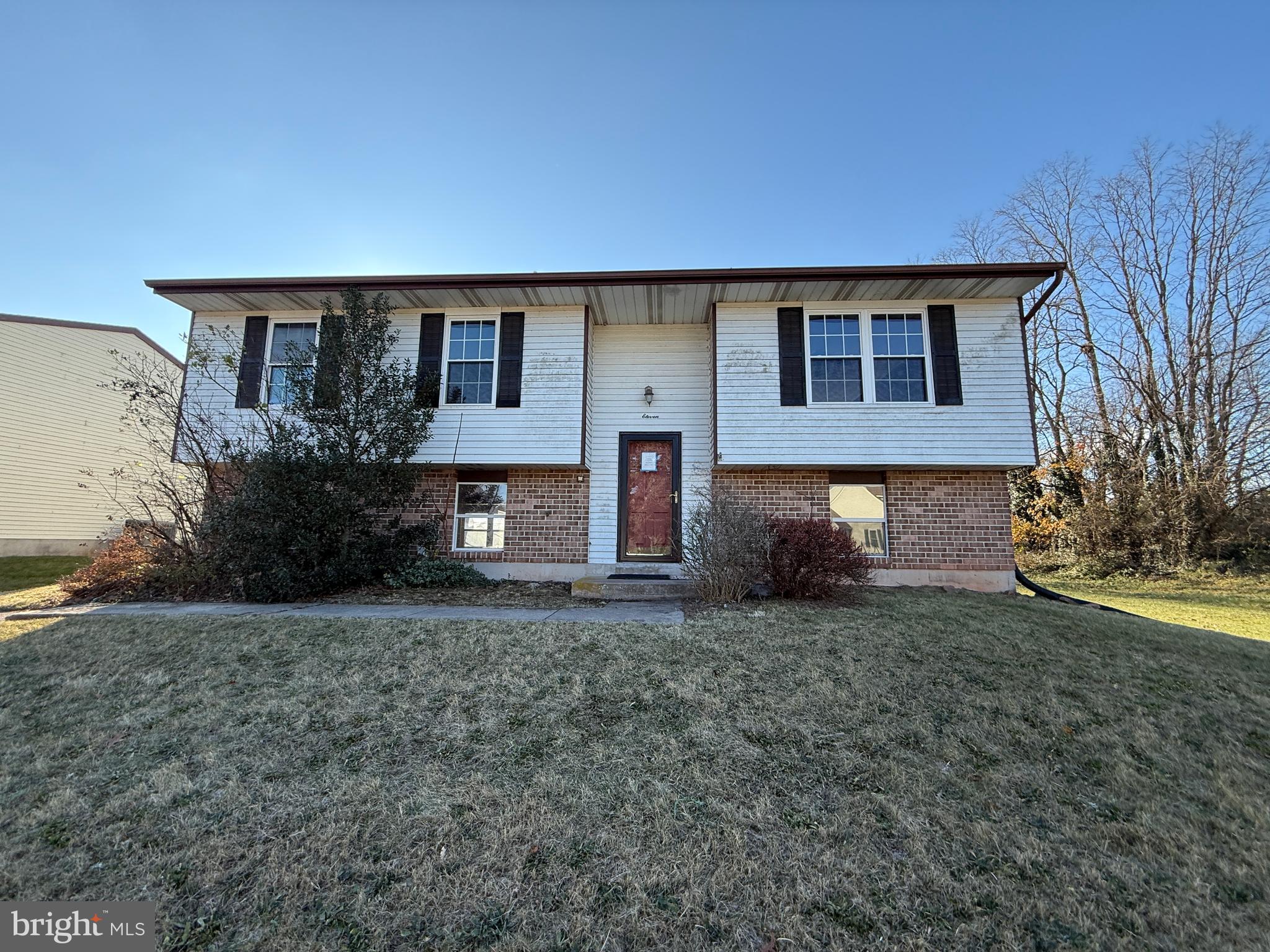 front view of a house with a yard