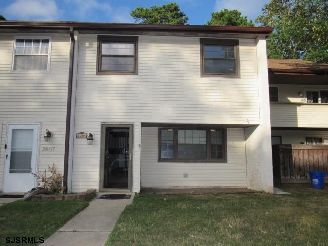 a front view of a house with garage