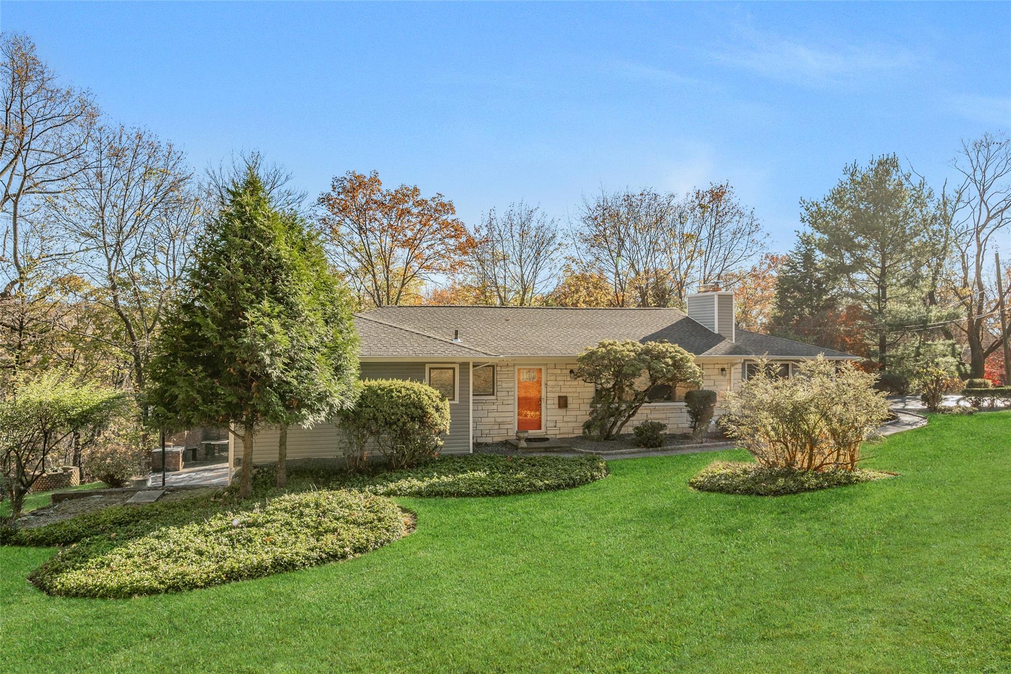 Single story home with a front lawn