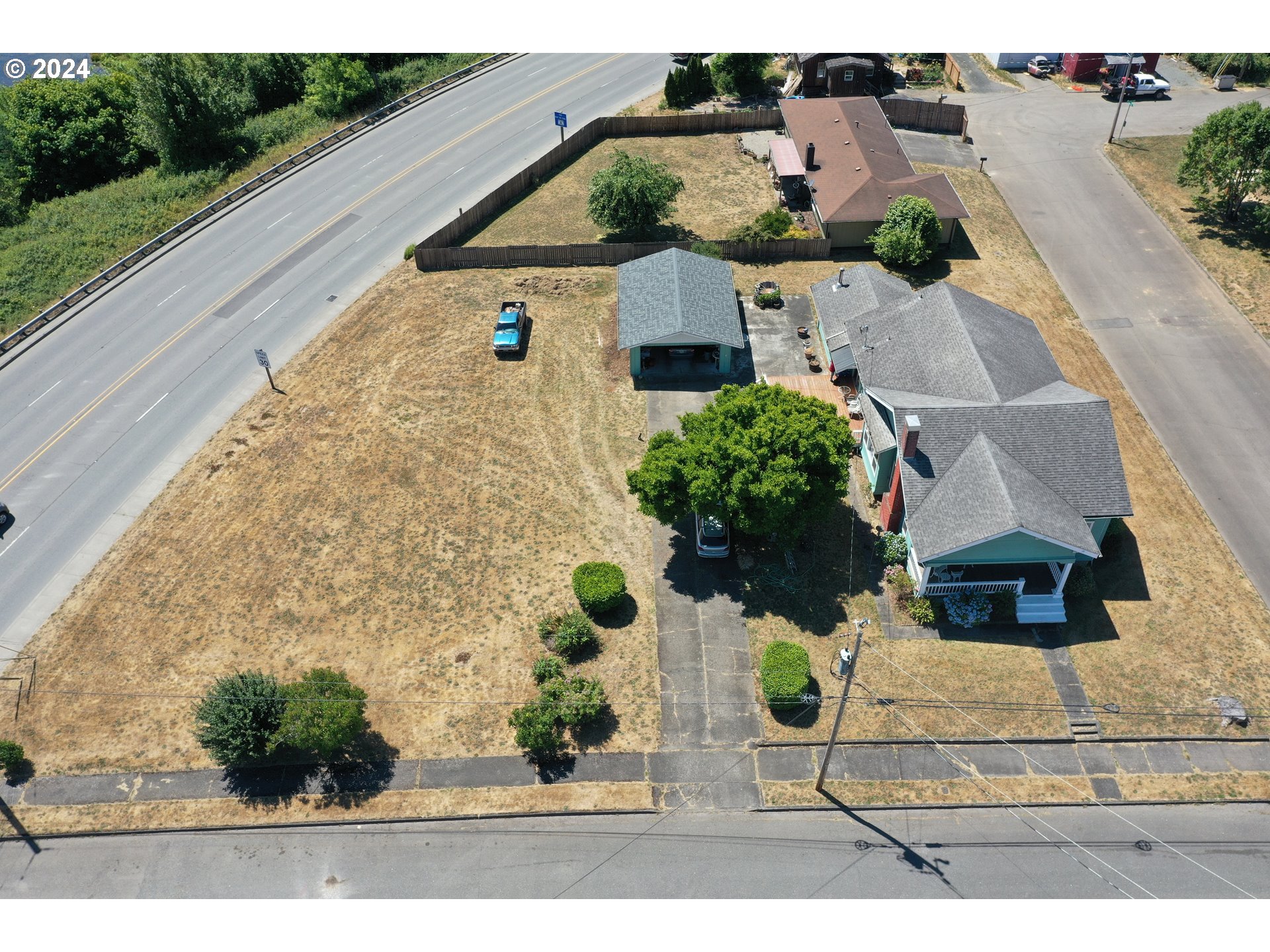 an aerial view of a house with yard