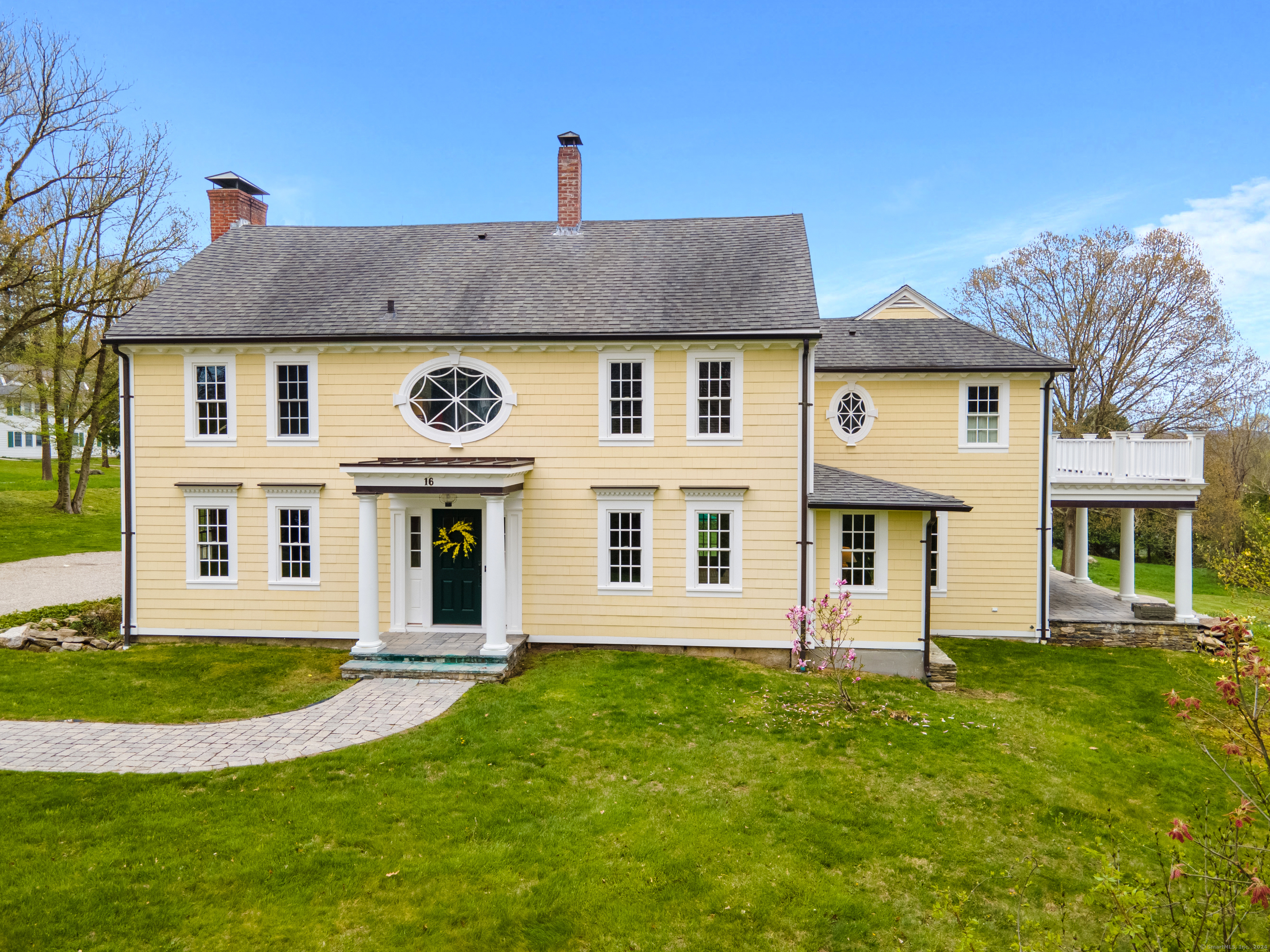 front view of a house with a yard