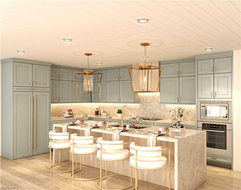 a kitchen with kitchen island granite countertop a sink cabinets and stainless steel appliances