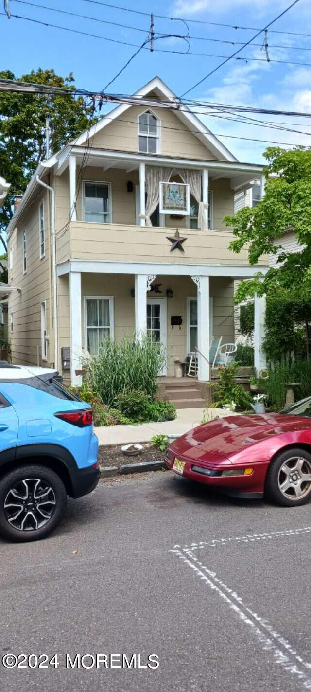 a front view of a house with parking space