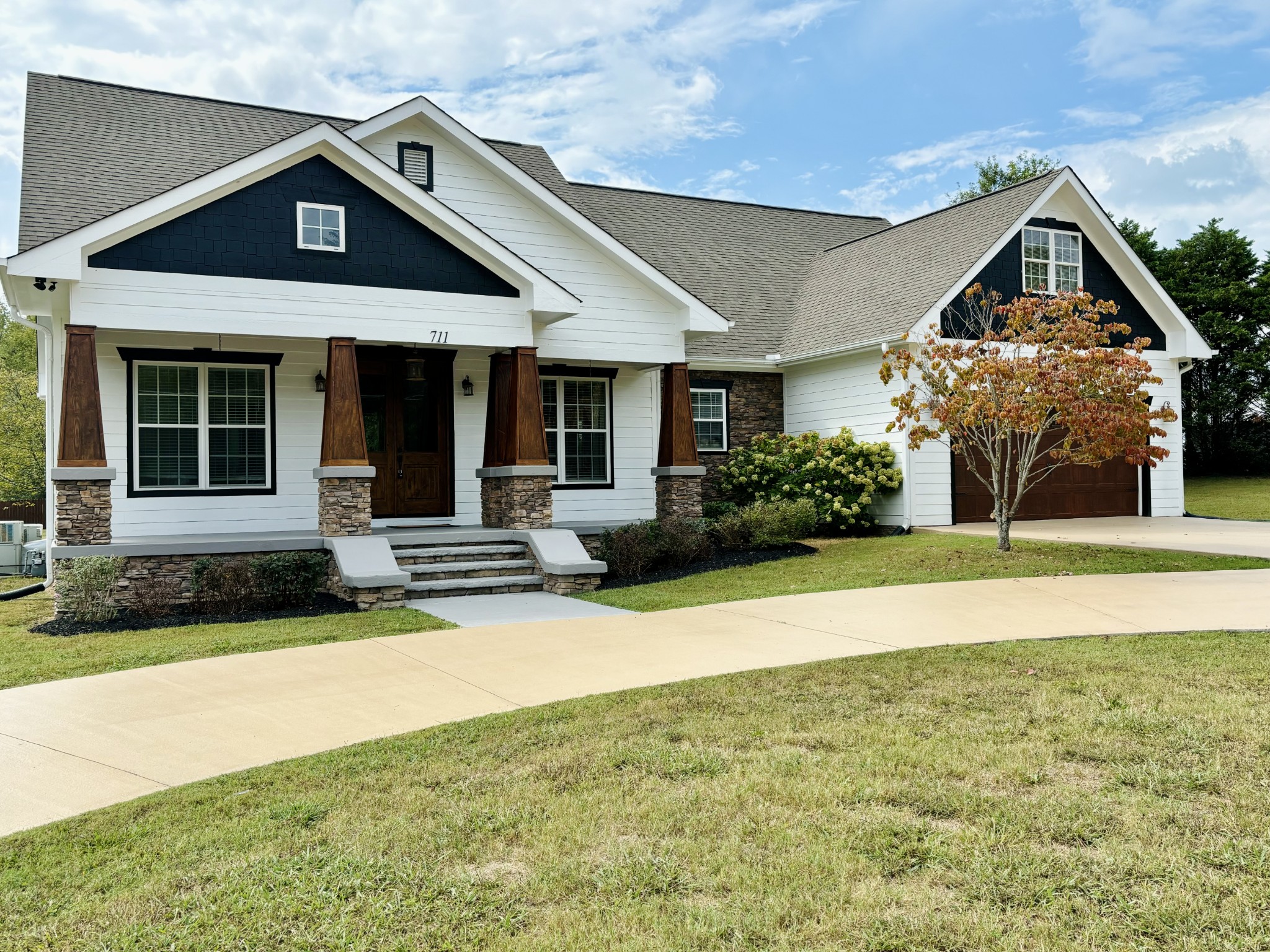 a front view of a house with garden