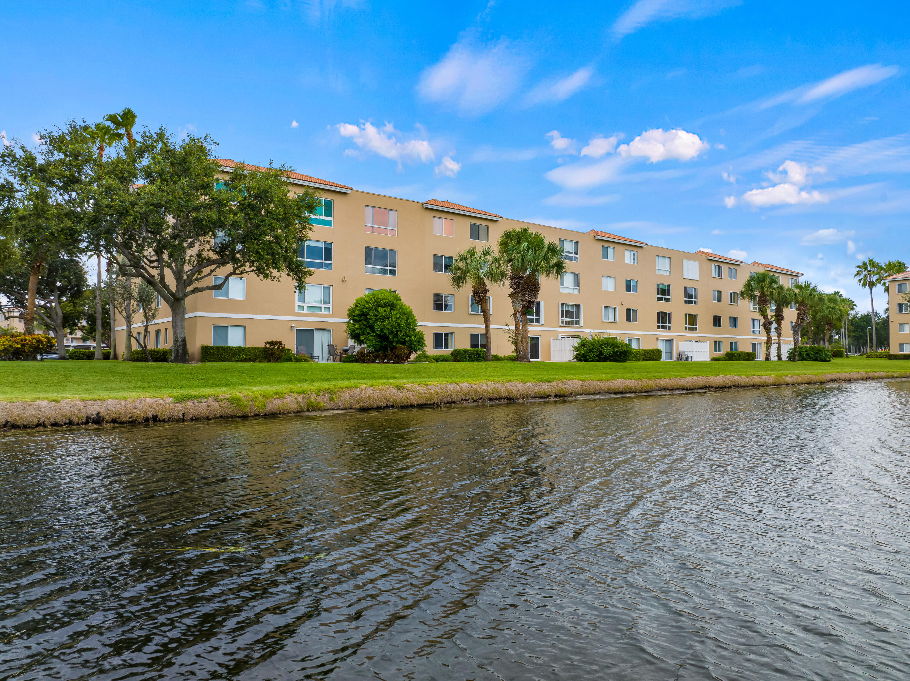 a view of building with river in front of it