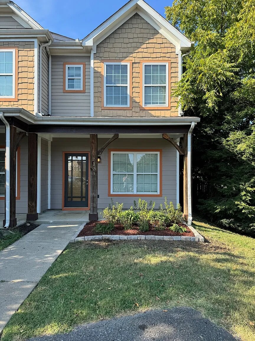 a front view of a house with garden