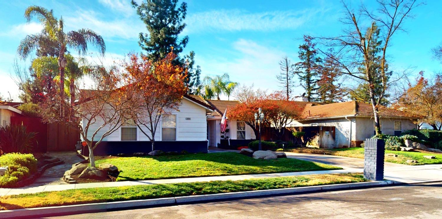 a view of a house with a yard and plants