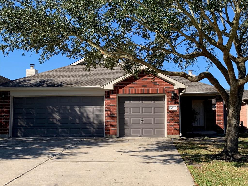 a house with a tree in front of it