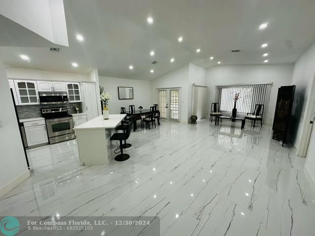 a kitchen with lots of counter top space and appliances