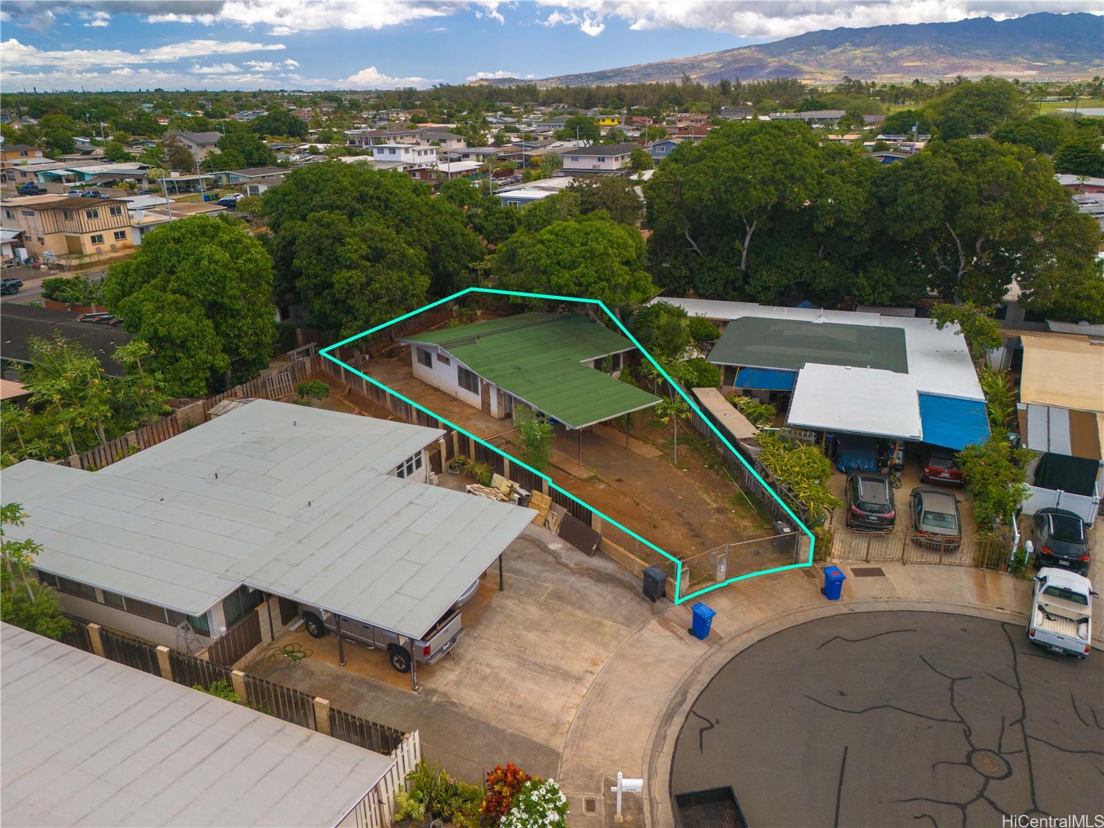 an aerial view of a house with pool and mountain view