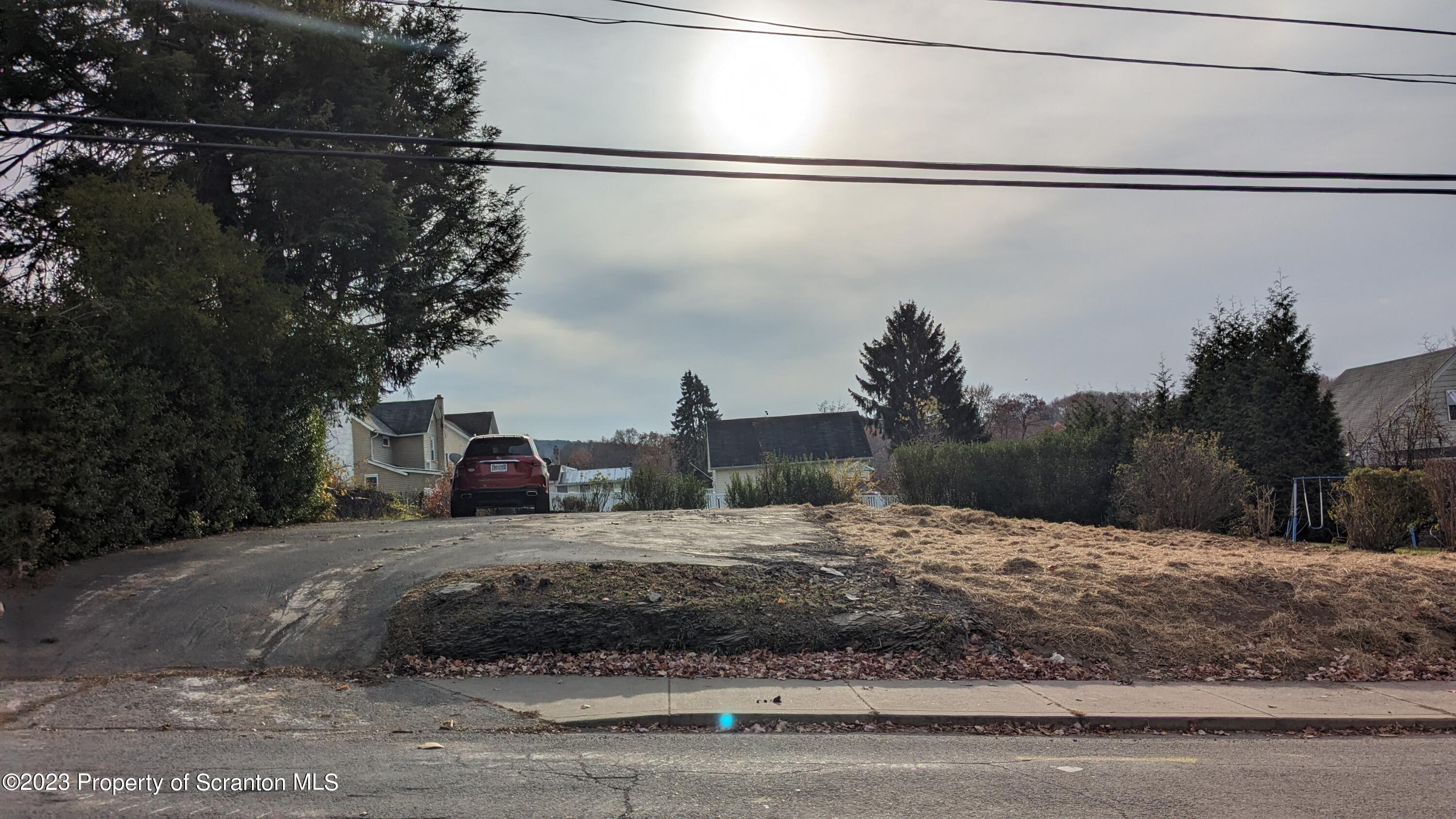 a view of a house with a street