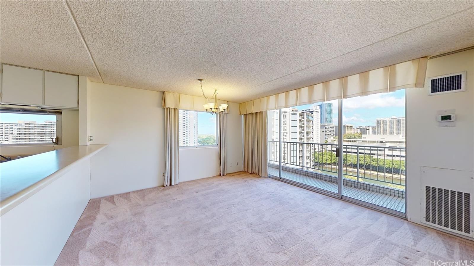 a view of an empty room with a window