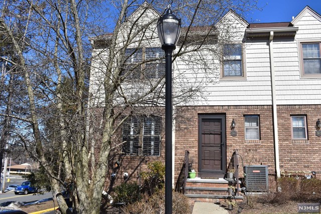 a view of a house with a tree