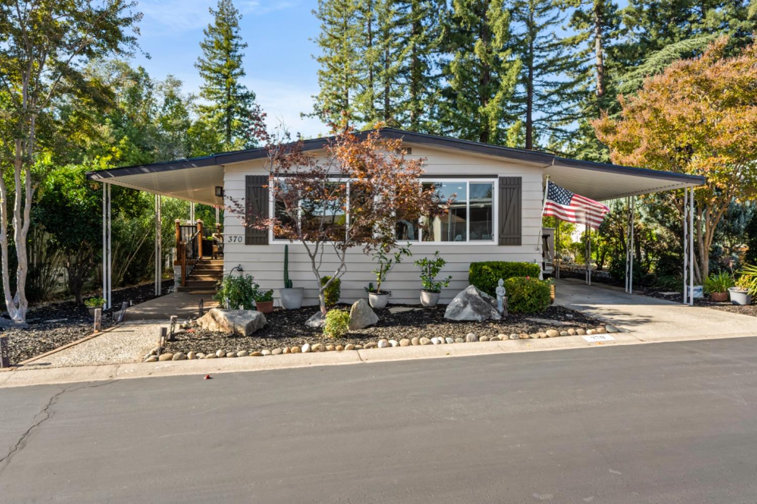 a front view of house with yard outdoor seating and livingroom