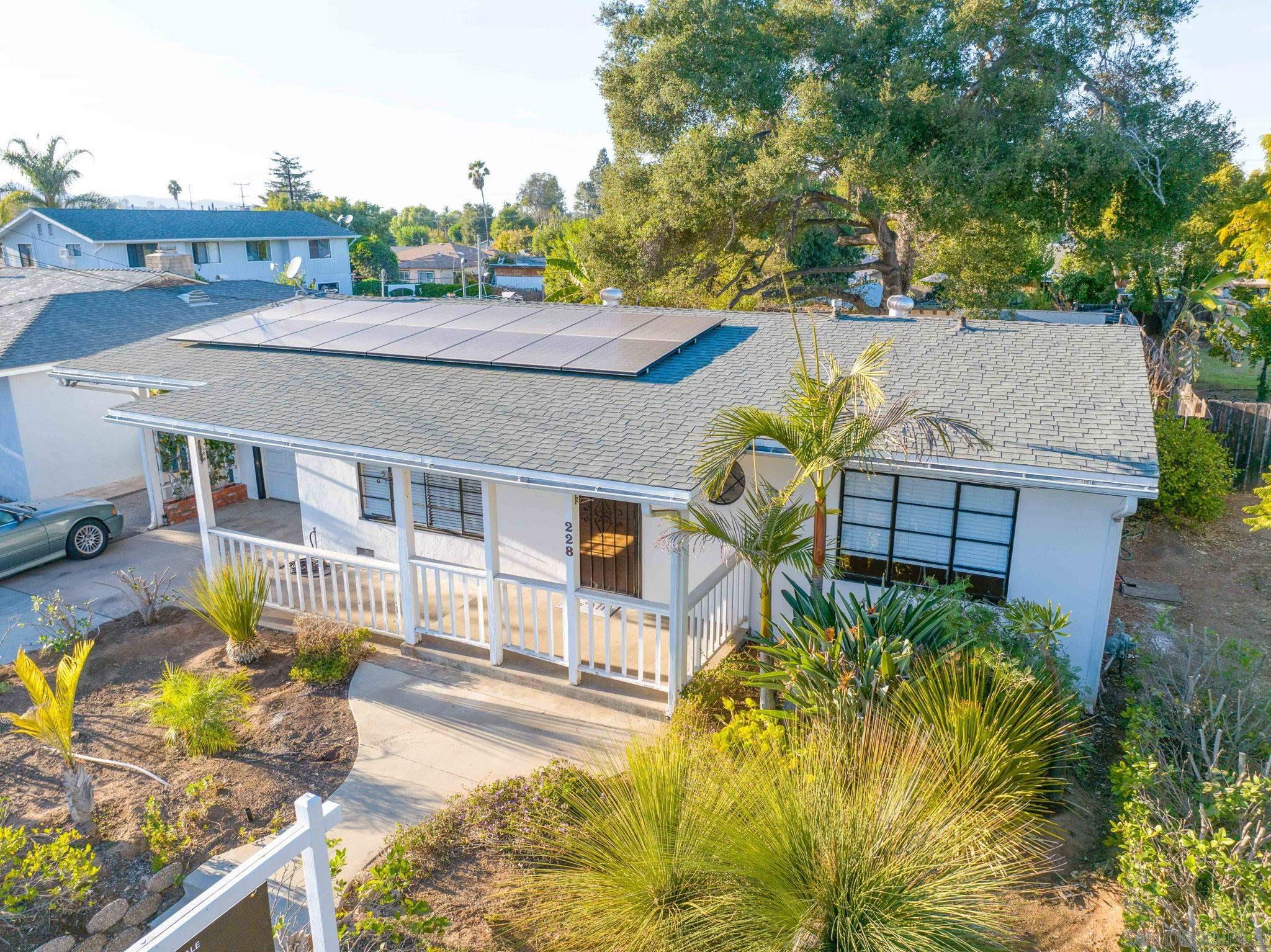 a aerial view of a house with swimming pool