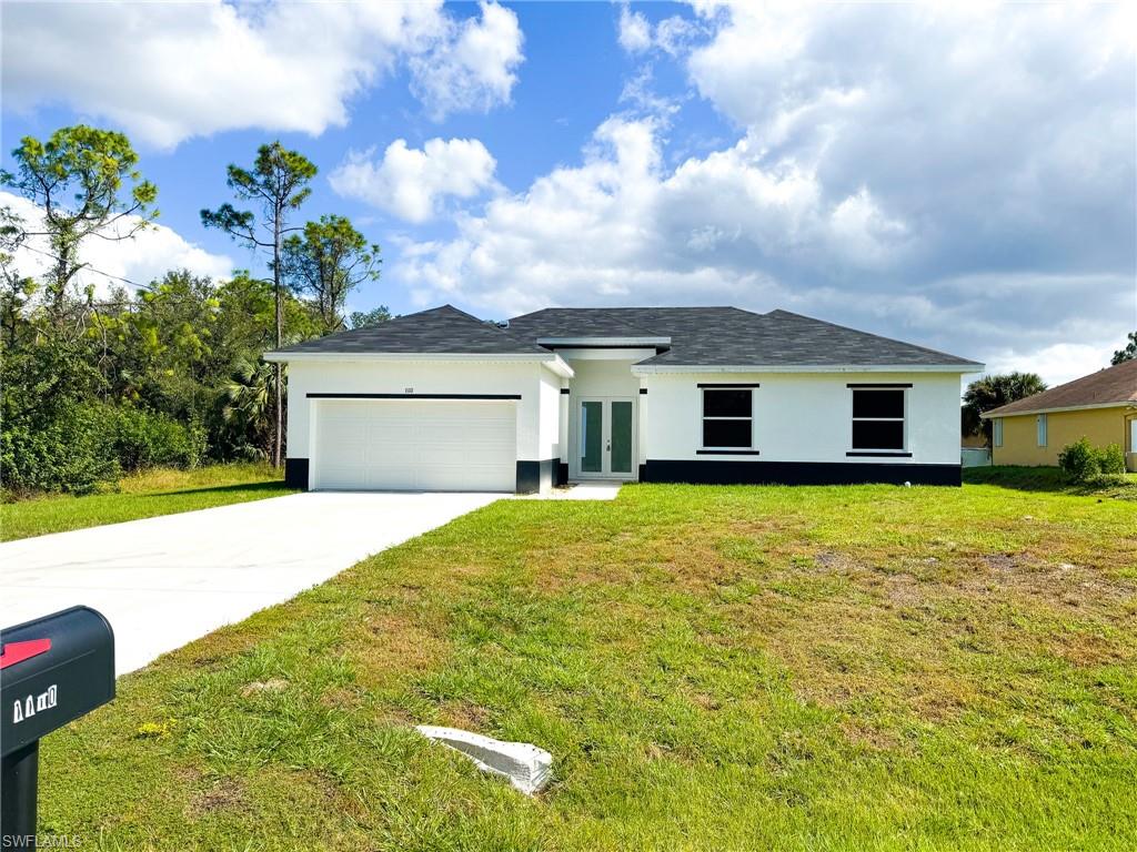 a front view of a house with a yard