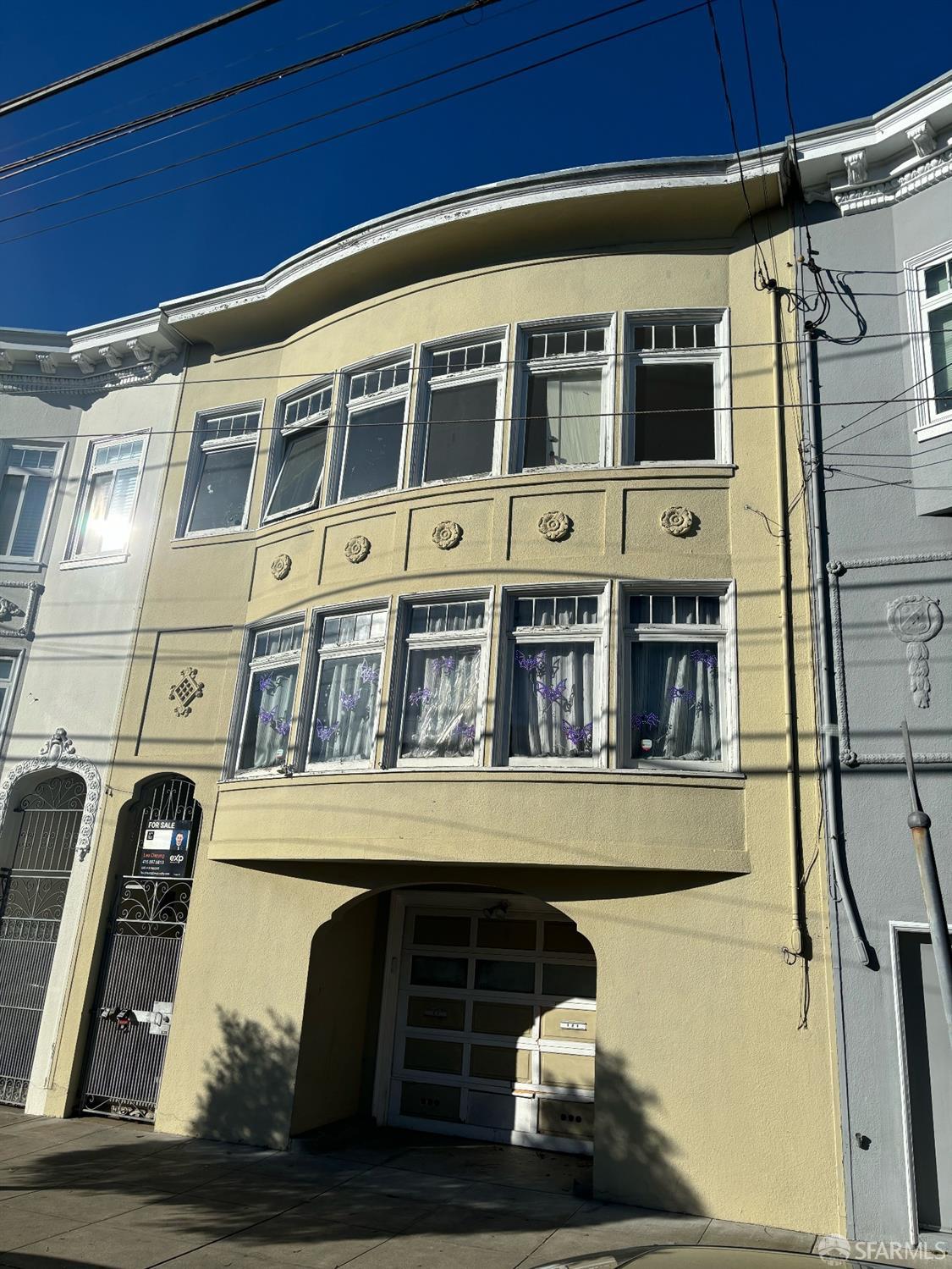 a front view of a building with glass windows