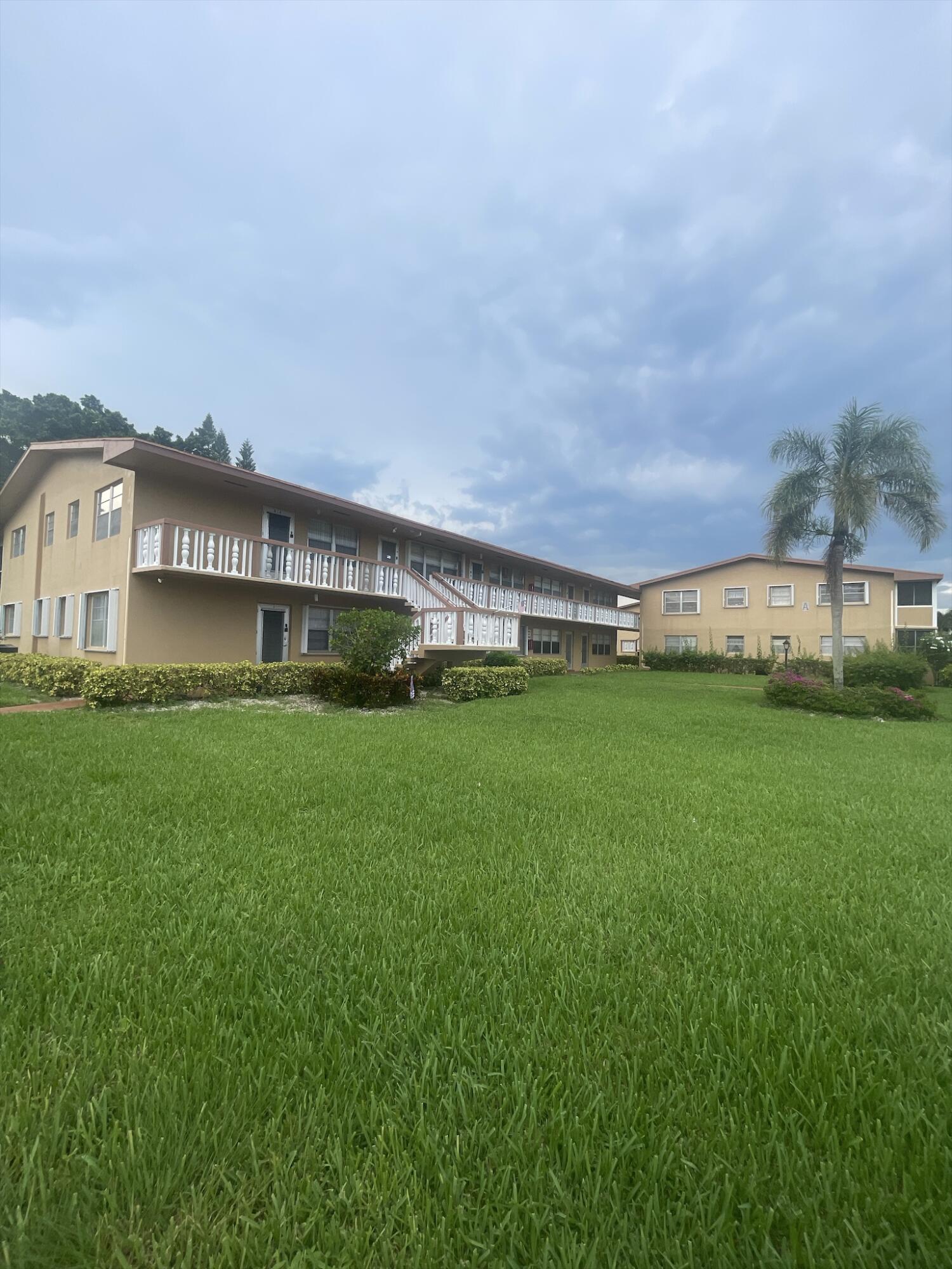 a view of building with a big yard