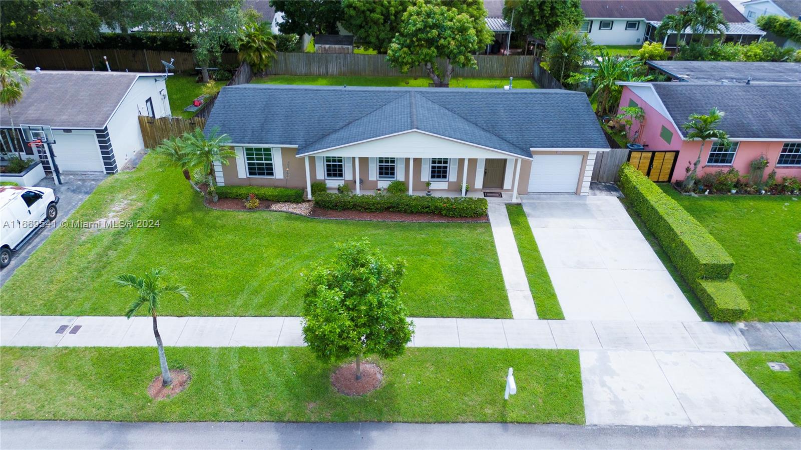 a aerial view of a house with a yard