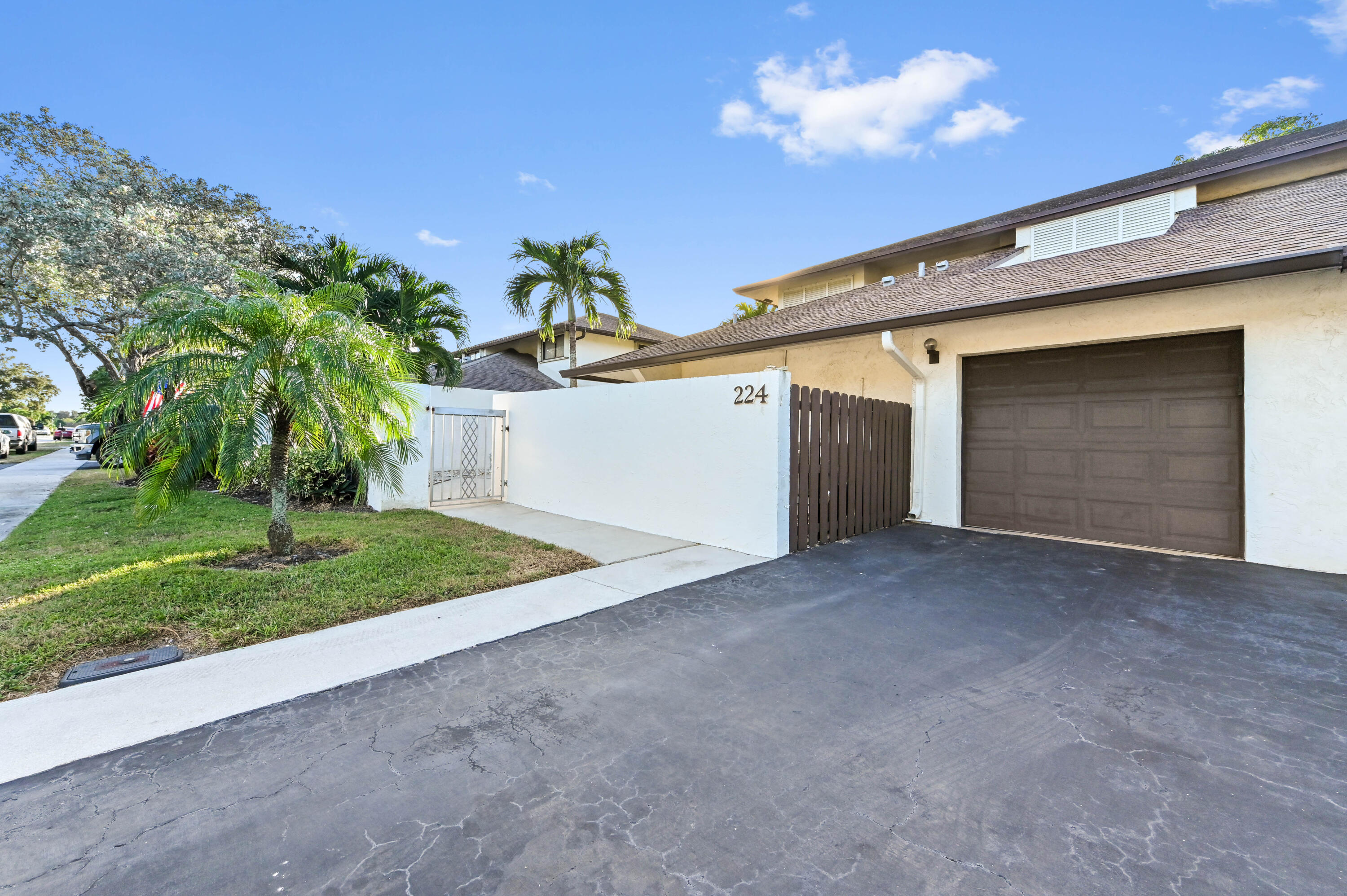 a view of a house with a yard and garage