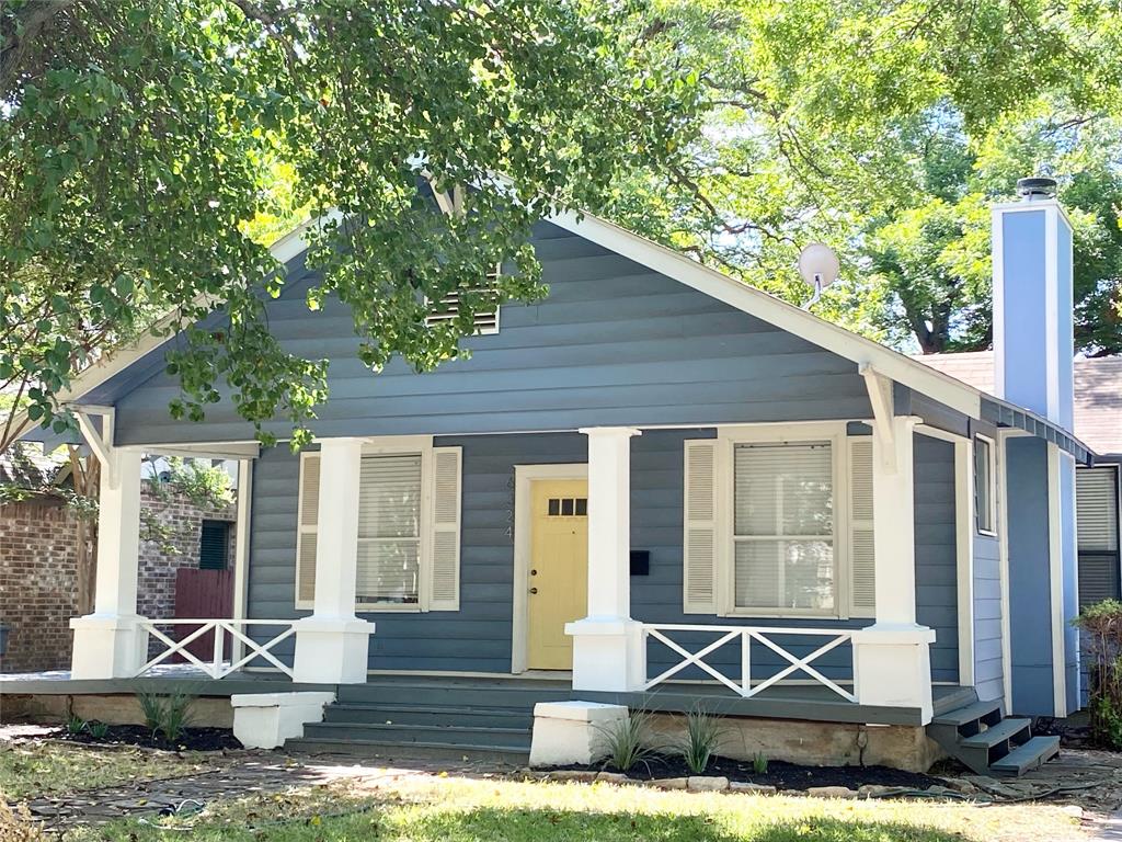 a front view of a house with porch yard