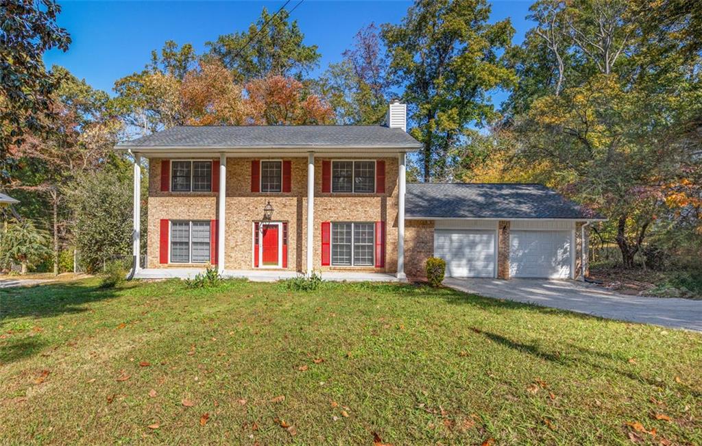 front view of a house with a yard