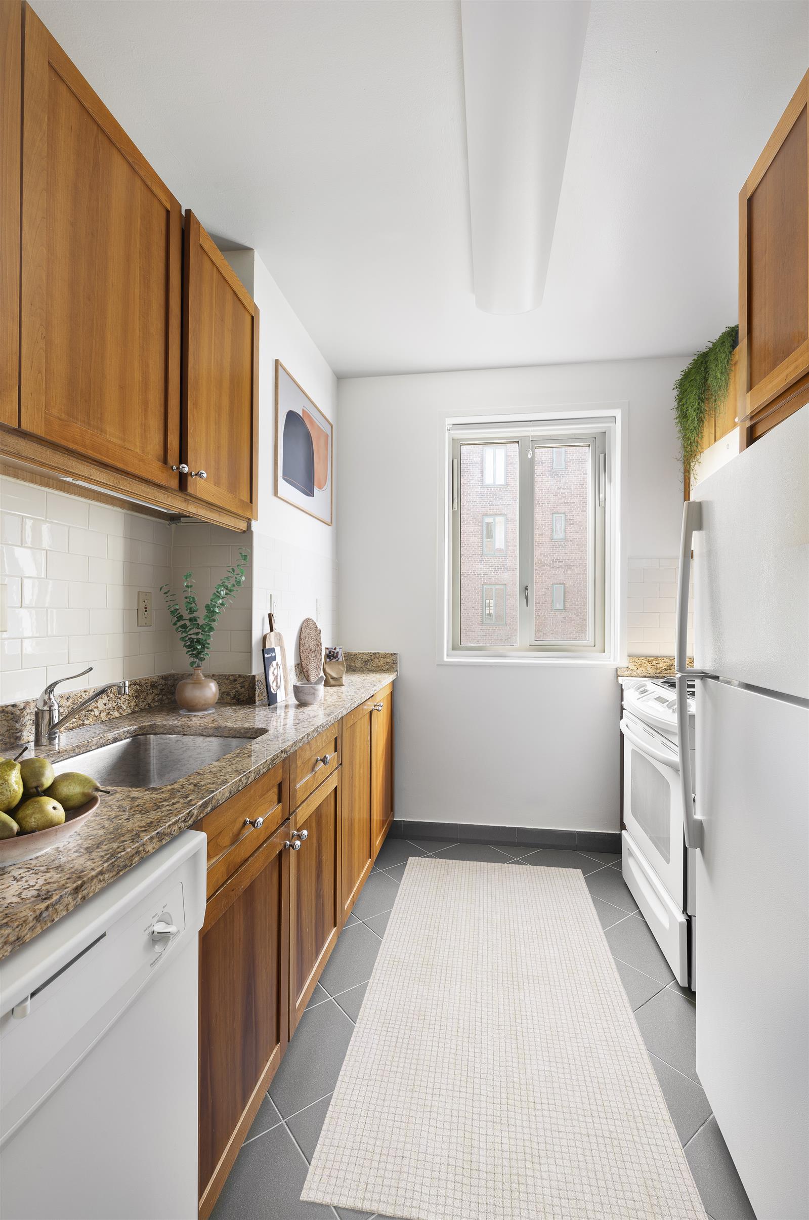 a kitchen with a sink a stove and cabinets