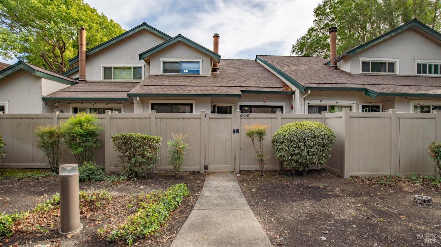 a view of front of house with a yard