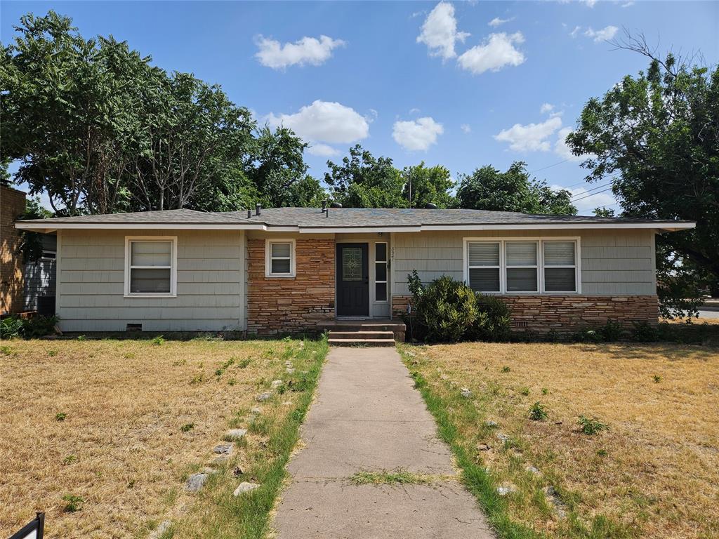 front view of a house with a yard