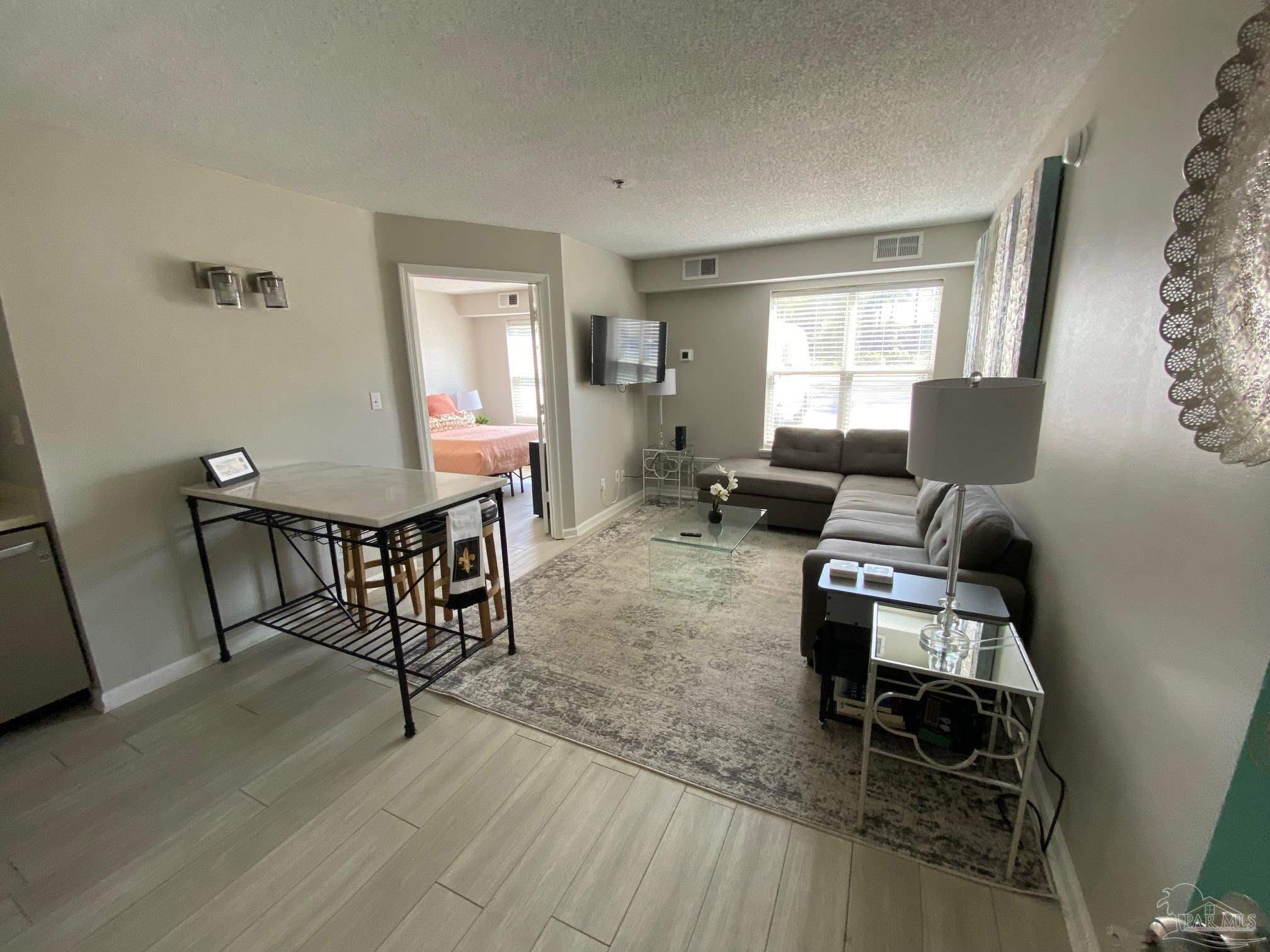 a living room with furniture and a window