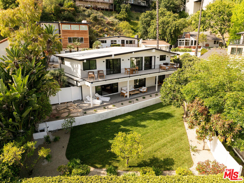 a view of houses with swimming pool