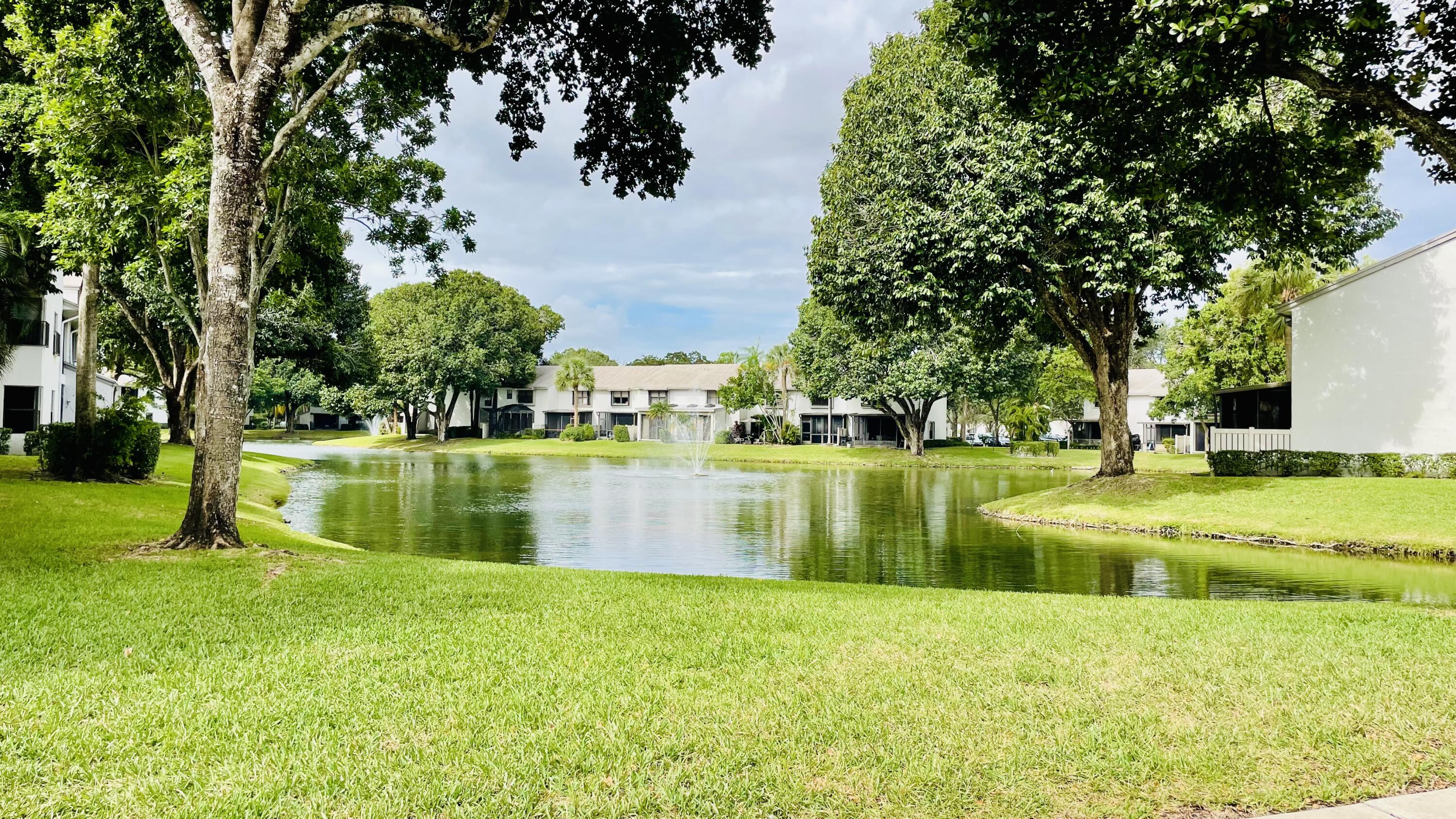 a view of swimming pool with a yard