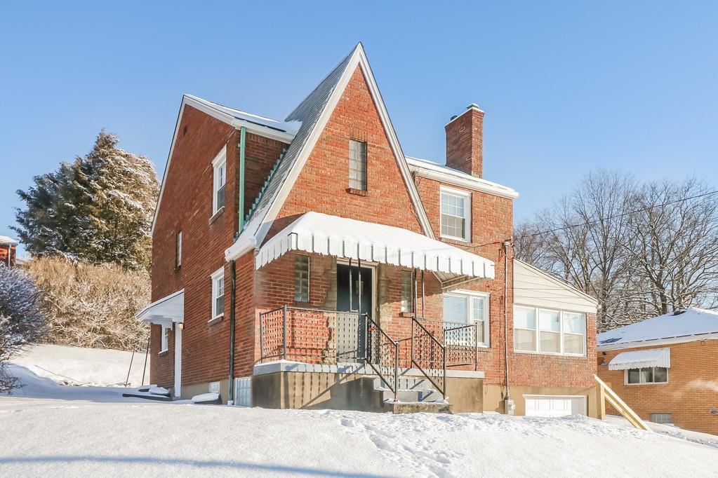 a view of a house with a snow