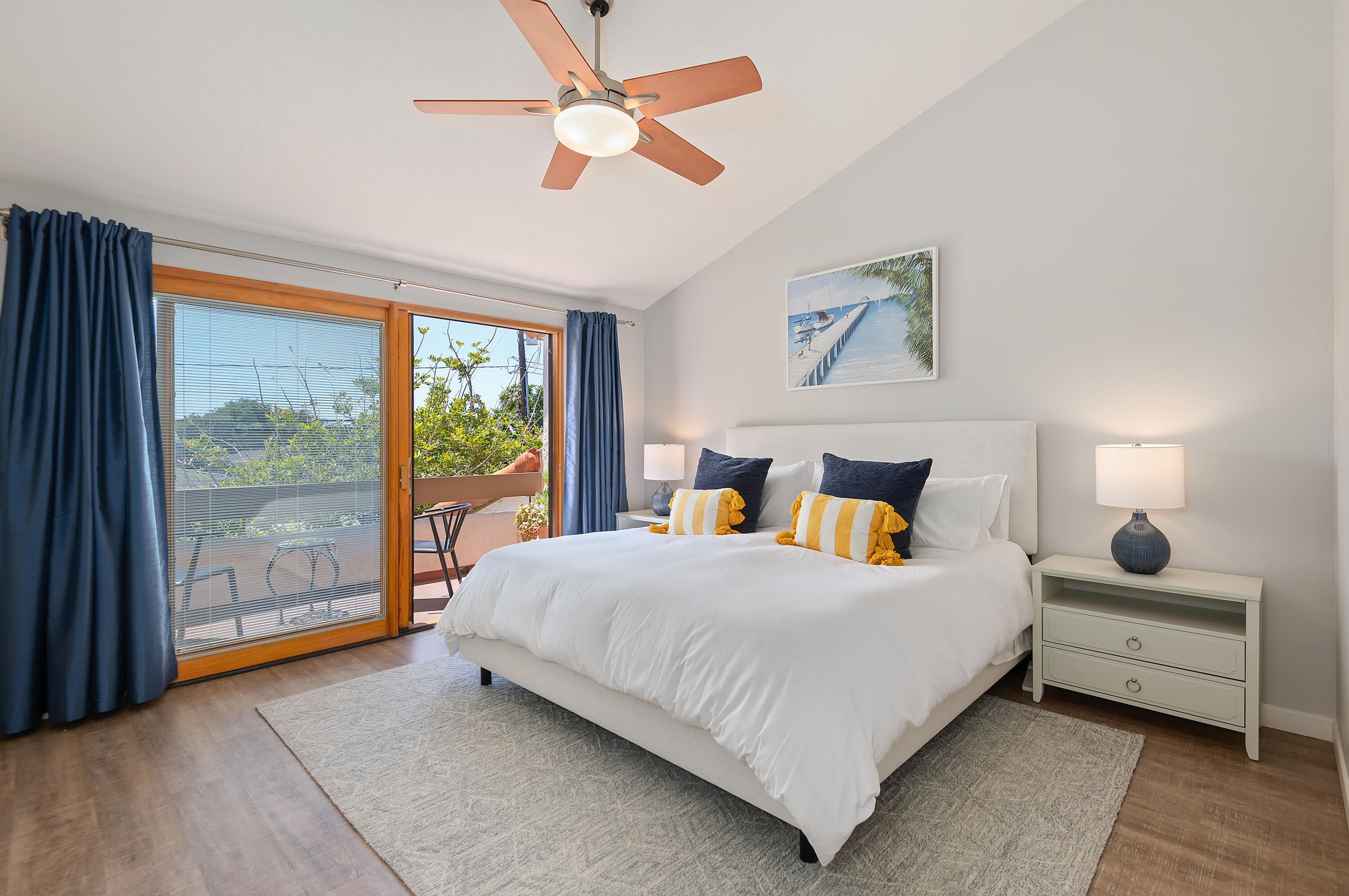 a bedroom with a large bed and a large window