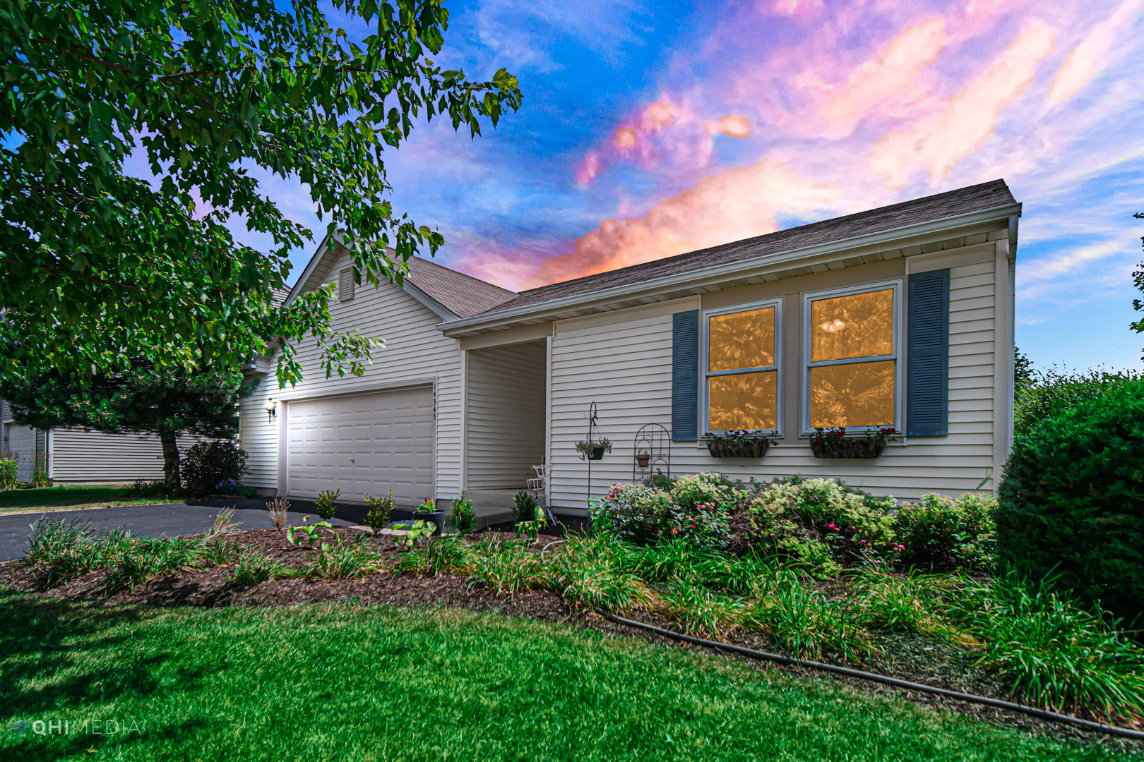 a front view of a house with garden