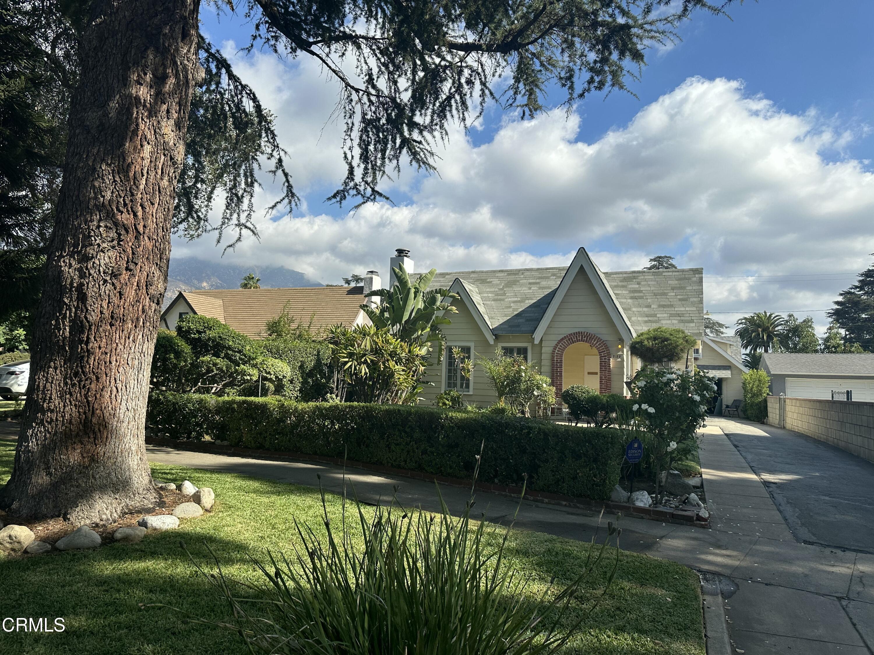 a front view of a house with garden