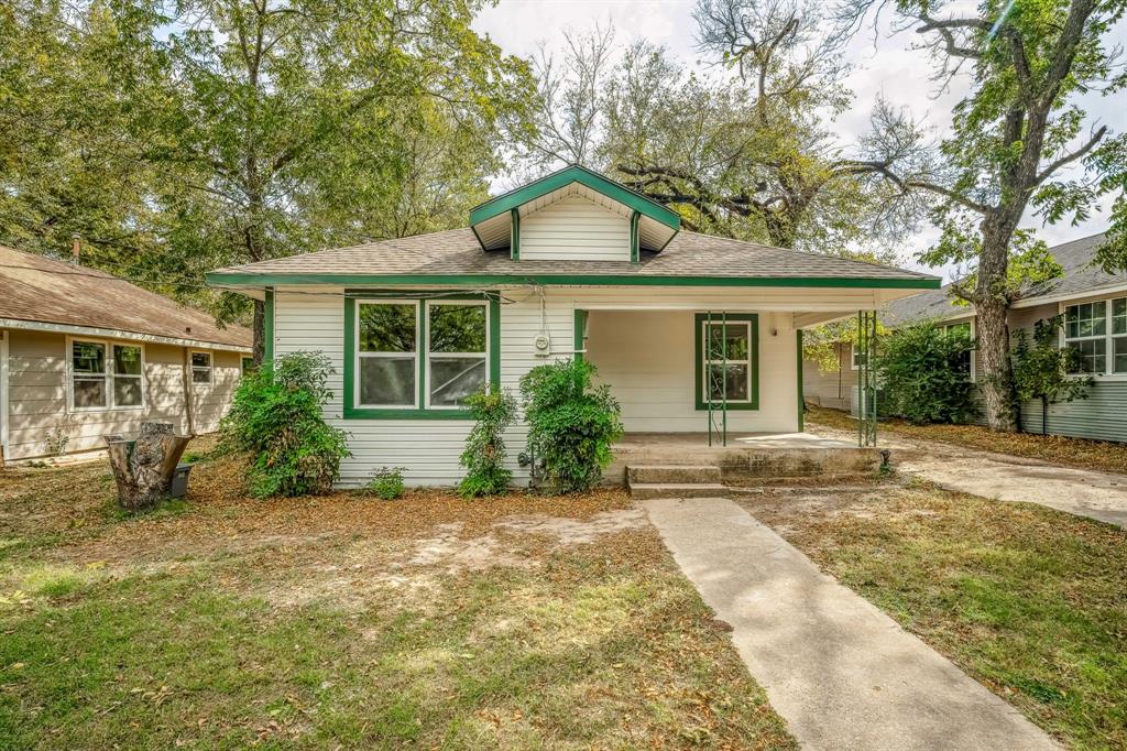 front view of a house with a small yard