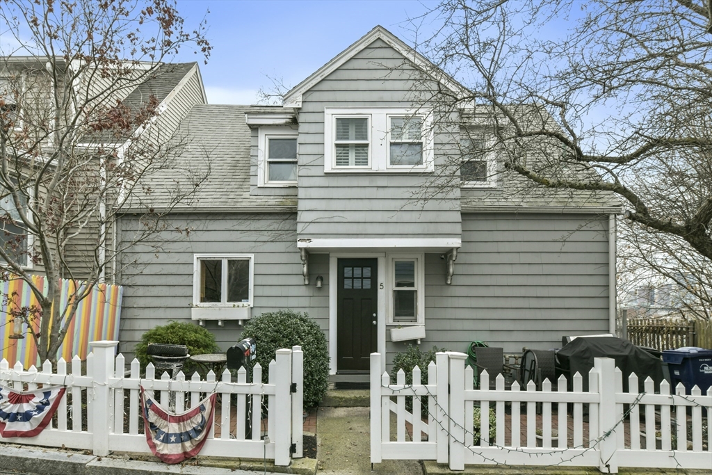 a front view of a house with deck