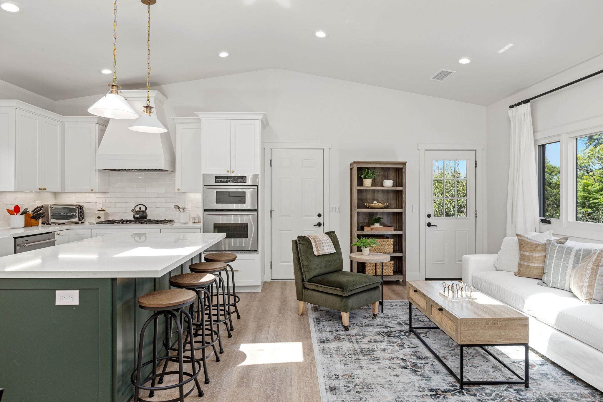 a view of kitchen island dining table and chairs